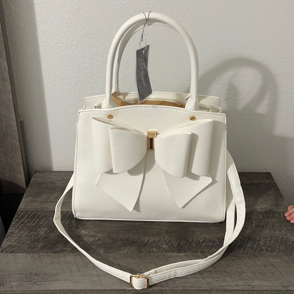 White Crossi brand hand bag